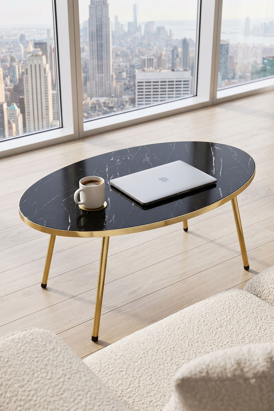 Table basse ovale à pieds dorés 2